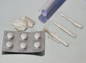 photo of cocaine and generic viagra pills on a table