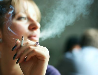 young woman smoking cigarette